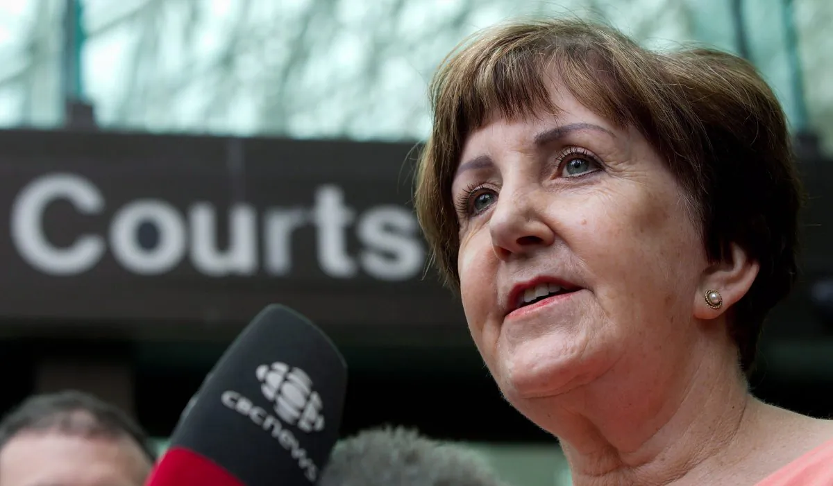 Former RCMP officer Valerie MacLean, one of the hundreds of current and former female Mounties who have come forward to join a class-action lawsuit alleging harassment and gender-based discrimination against the force, speaks to reporters outside British Columbia Supreme Court in Vancouver after the first hearing in the suit on August 2, 2012. (THE CANADIAN PRESS/Darryl Dyck)
