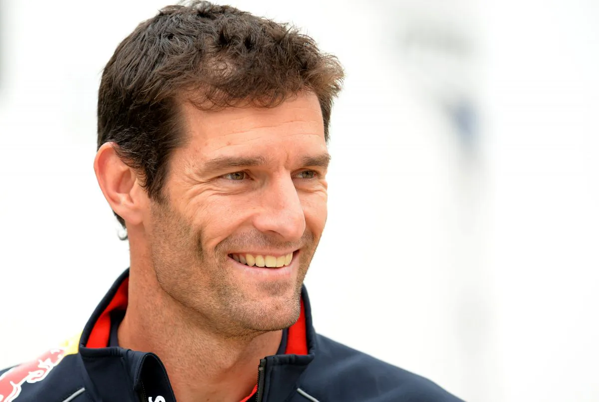 Red Bull Racing's Australian driver Mark Webber smiles in the paddock at the Silverstone circuit in Silverstone on July 27, 2013 ahead of the British Formula One Grand Prix. (Andrew Yates/AFP/Getty Images)