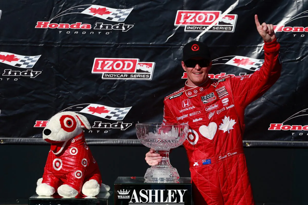 Scott Dixon, driver of the #9 Target-Chip Ganassi Racing Honda, poses with the trophy in Victory Lane following his win in the Izod IndyCar Series Honda Indy Toronto Race #1 on July 13, 2013. (Chris Trotman/Getty Images)