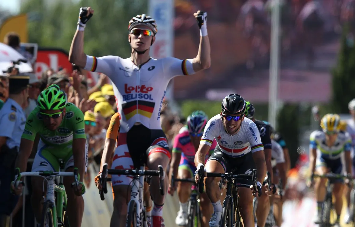 André Greipel of Lotto-Belisol crosses the line to win Stage Six of the 2013 Tour de France, a 176.5KM road stage from Aix-en-Provence to Montpellier, on July 4, 2013 in Aix-en-Provence, France. (Doug Pensinger/Getty Images)