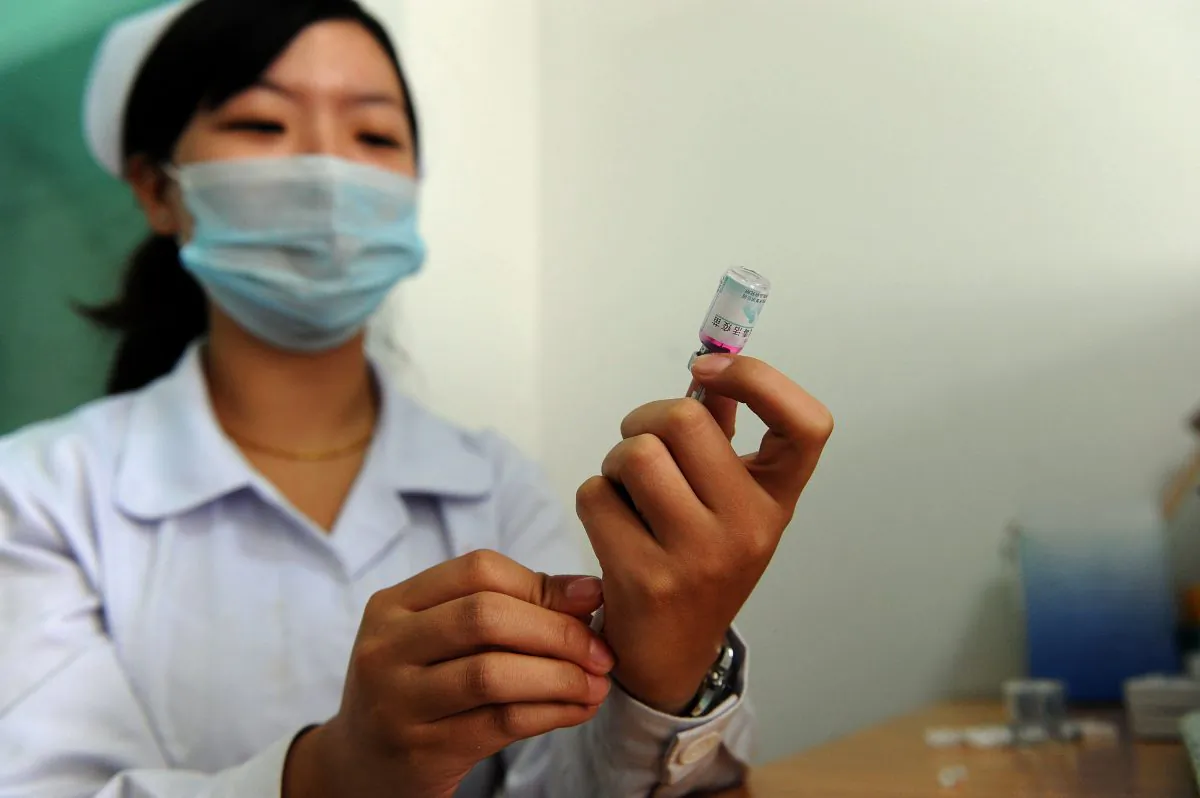 A Chinese nurse prepares a dose of vaccination against measles in Anhui province in September 2010. Chinese vaccines have been criticized for their inferior quality, and damage to the children they are given to. (STR/AFP/Getty Images)