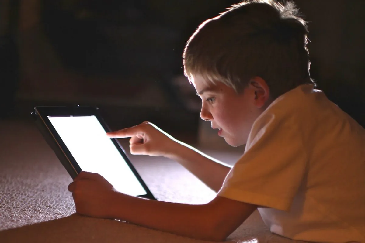 A young boy uses a tablet computer. A plan in the U.K. to offer parents a pornography filter through their ISP is garnering criticism for censorship implications but is necessary to protect children, argues Canadian MP Joy Smith. (Christopher Furlong/Getty Images)