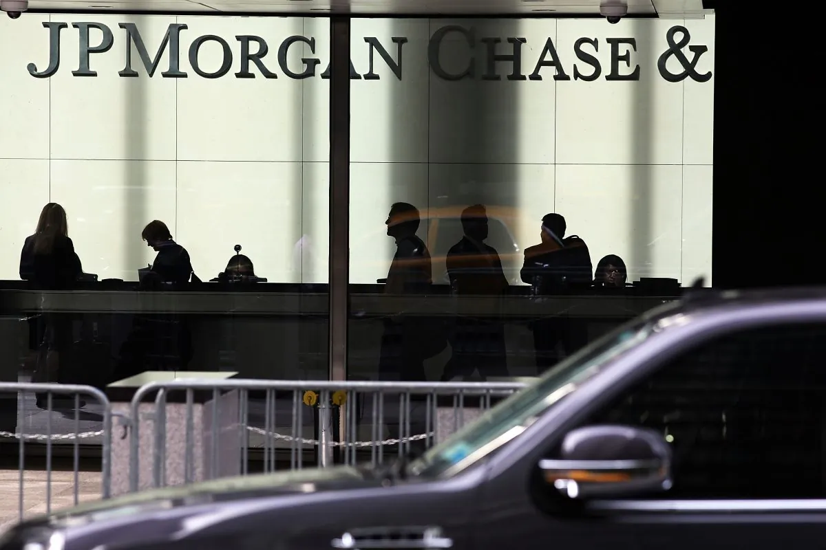 People pass a sign for JPMorgan Chase & Co. at its headquarters in Manhattan, Oct. 2, 2012, when New York’s Attorney General filed a lawsuit against the bank alleging fraud related to mortgages in the lead-up to the financial crisis. Despite increased scrutiny from regulators, public trust in banks is lower than it was in 2008, according to public relations firm, Edelman.
(Spencer Platt/Getty Images)