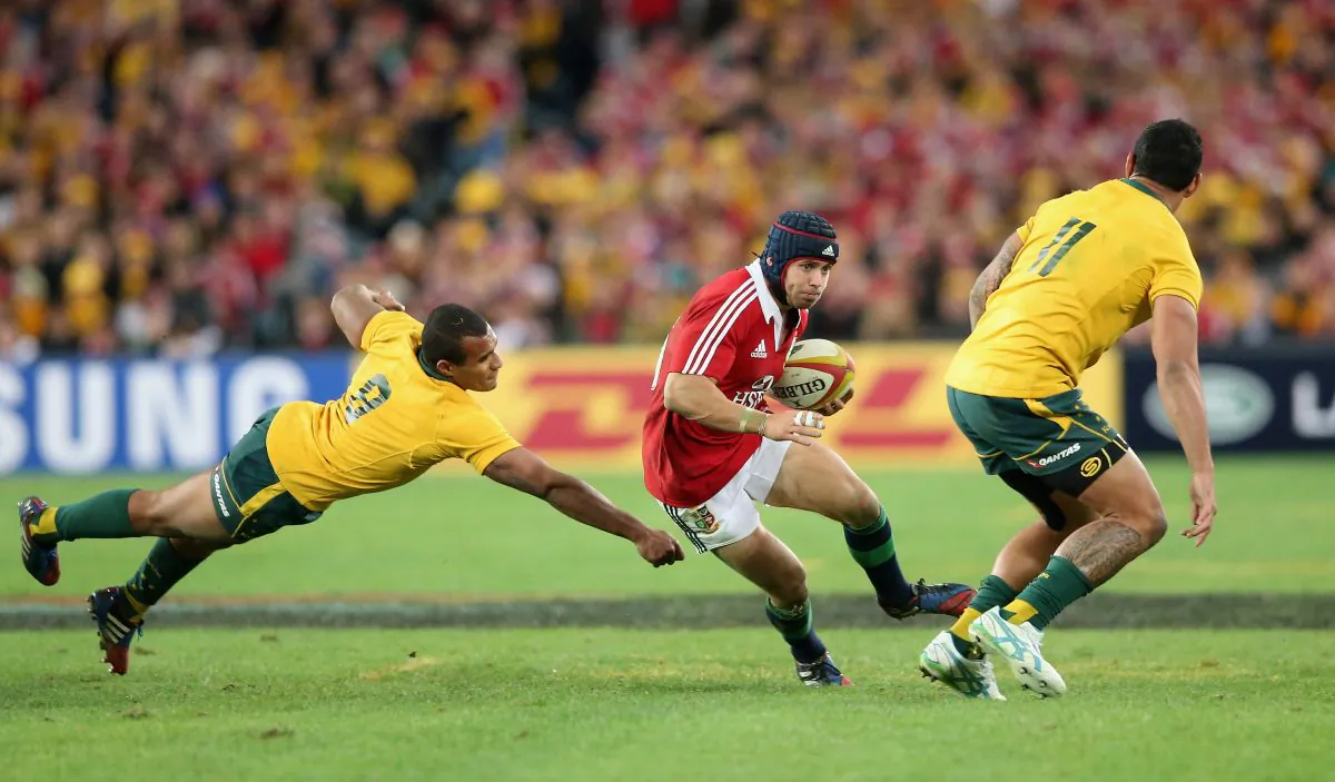 Man of the series British and Irish Lions Leigh Halfpenny steps around Wallabies star Will Genia and then back inside Joe Tomane to break free during the last of the 3-Test series at ANZ Stadium, Sydney, on July 6, 2013. (David Rogers/Getty Images)