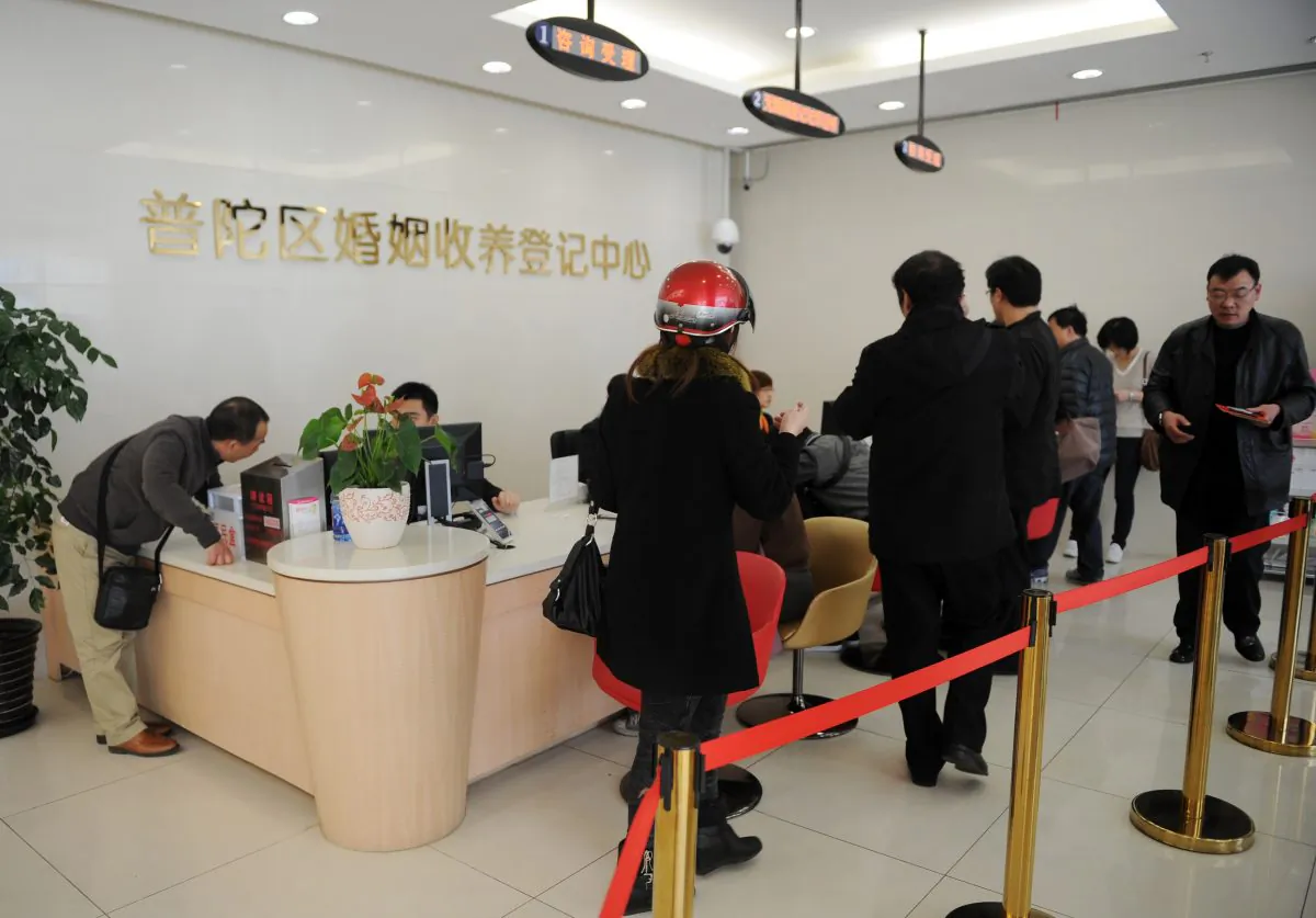 People line up at an office to register for marriage or divorce in Shanghai, China, on March 6, 2013. (Peter Parks/AFP/Getty Images)
