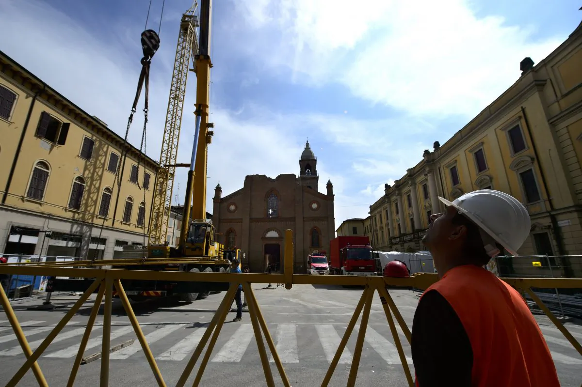 A damaged church in Mirandola on May 22, 2013, a year after an earthquake in the Emilia region of Italy. The rebuilding process in the Emilia region has been helped by microcredit schemes. (Olivier Morin/AFP/Getty Images)