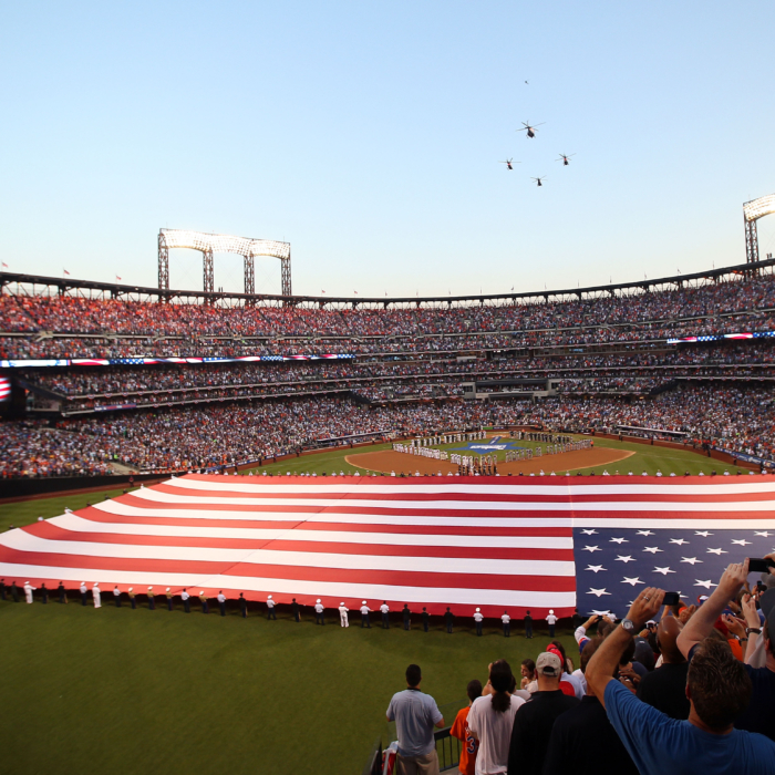 The story behind the massive American flags at sporting events