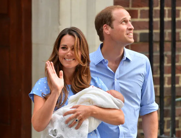 Prince William and Catherine, Duchess of Cambridge show their new-born baby boy to the world's media, on the steps outside the Lindo Wing of St Mary's Hospital in London on July 23, 2013. The baby was born on Monday afternoon weighing eight pounds six ounces (3.8 kilogrammes). The baby, titled His Royal Highness, Prince (name) of Cambridge, is directly in line to inherit the throne after Charles, Queen Elizabeth II's eldest son and heir, and his eldest son William.  (BEN STANSALL/AFP/Getty Images)