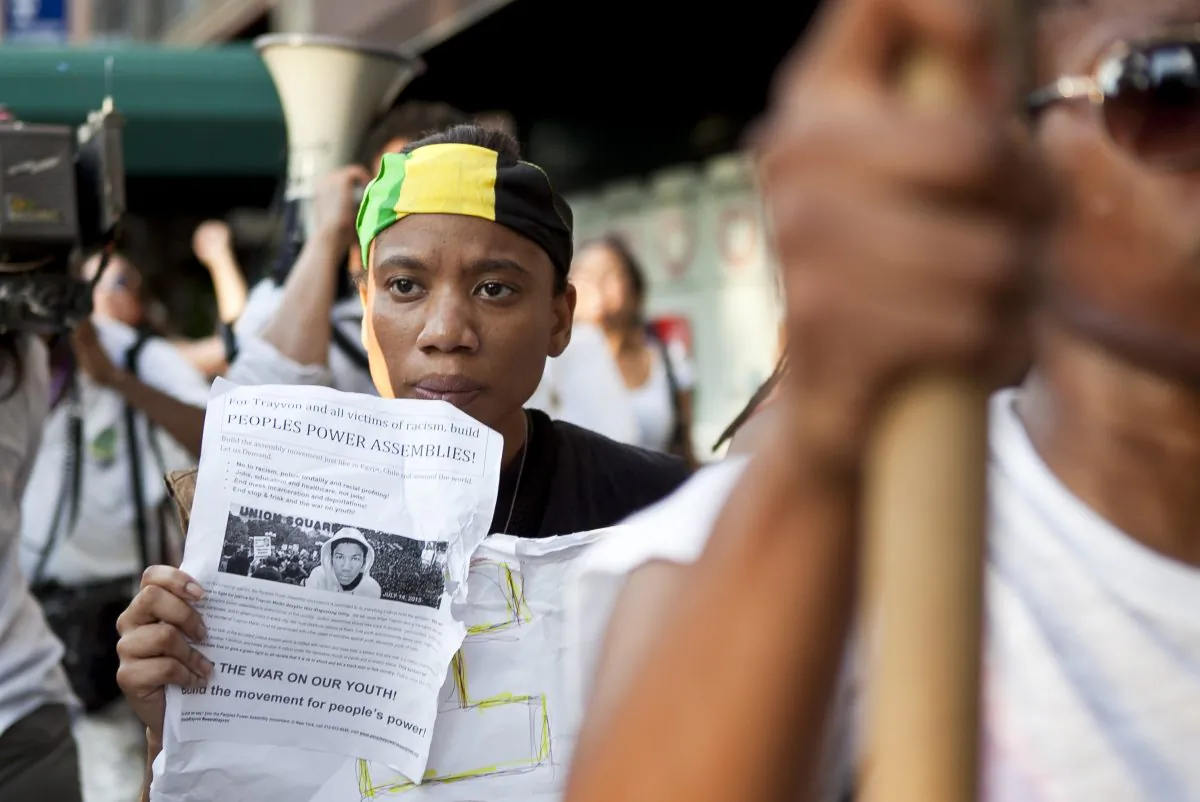 Esther Hazel from Brooklyn takes part in a rally against the verdict in the George Zimmerman case and march through city streets on July 15, 2013. (Samira Bouaou/Epoch Times)