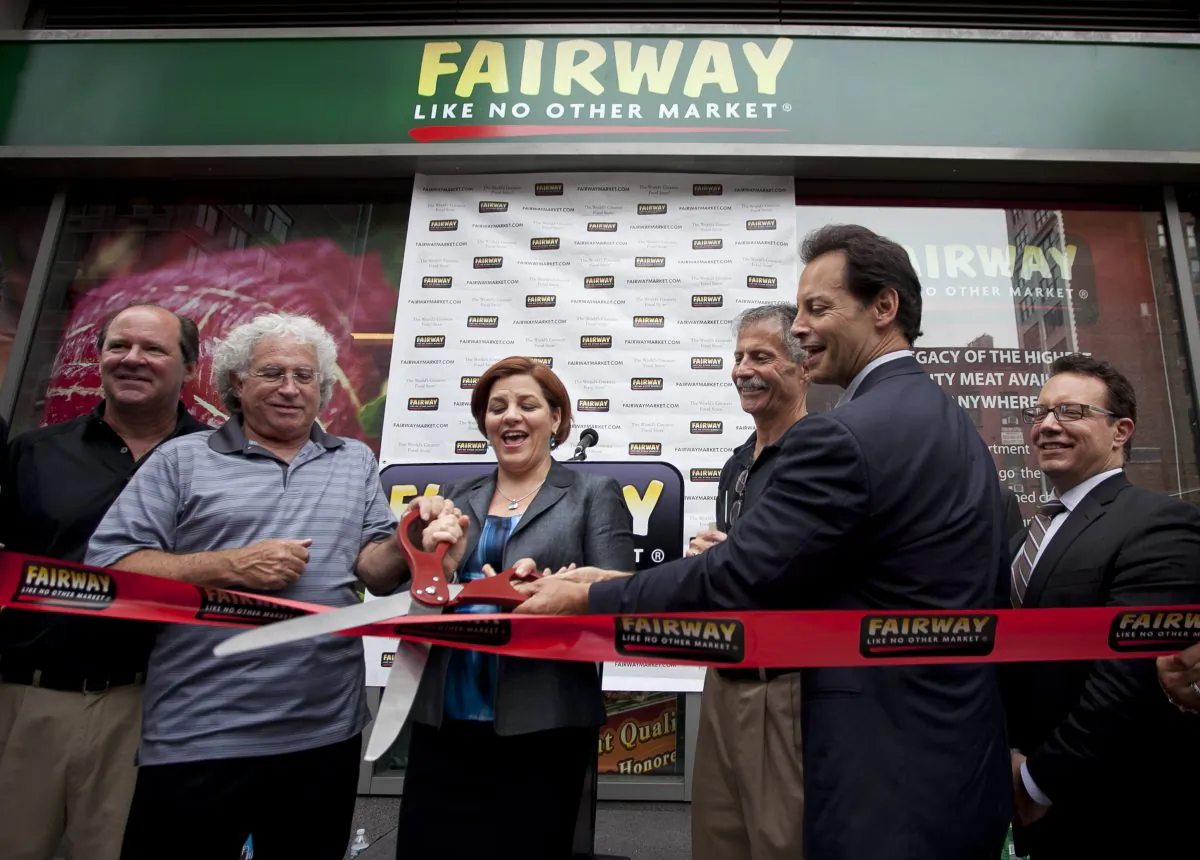 (L-R) Third generation owner Howie Glickberg, City Council Speaker Christine Quinn, Fairway CEO Herb Ruetsch, and Fairway Chairman Charles Santoro cut the ribbon together at the grand opening of the new Fairway Market on Sixth Avenue between 26th and 25th streets, July 24, 2013.  (Samira Bouaou/Epoch Times)