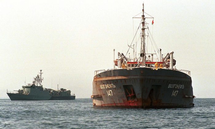 Russian oil tanker Volgoneft-147 stands under an Omani naval escort in Muscat's Mina al-Fahl port on Feb. 7, 2000. Mohamed Mahjoub/AFP/Getty Images.