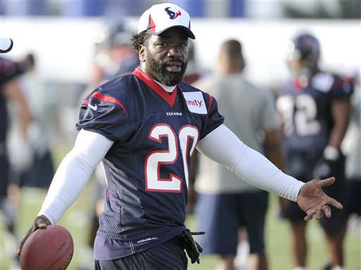 Houston Texans' Ed Reed gestures as he walks across the field during NFL football training camp Friday, July 26, 2013, in Houston. (AP Photo/Pat Sullivan)