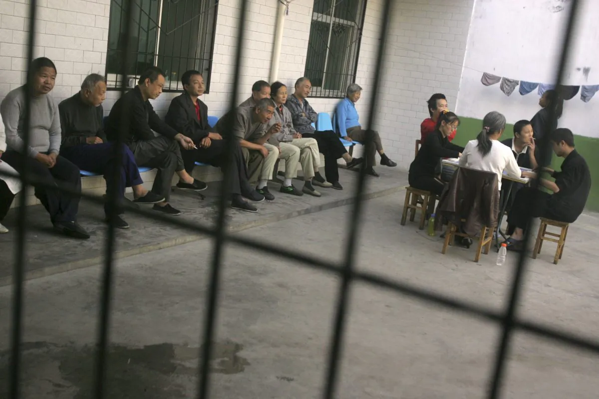 Patients are seen inside a psychiatric hospital in Xian in Shaanxi Province, China, on Oct. 8, 2006. Reports of sane people being forced into mental hospitals in China after complaining to authorities are increasing. (China Photos/Getty Images)