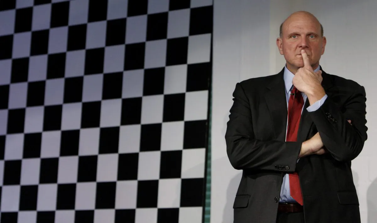 Steve Ballmer, CEO of Microsoft, follows a news conference in Germany in this file photo. Ballmer is set to retire within 12 months, but his legacy is marred by blunders. (AP Photo/Matthias Schrader)