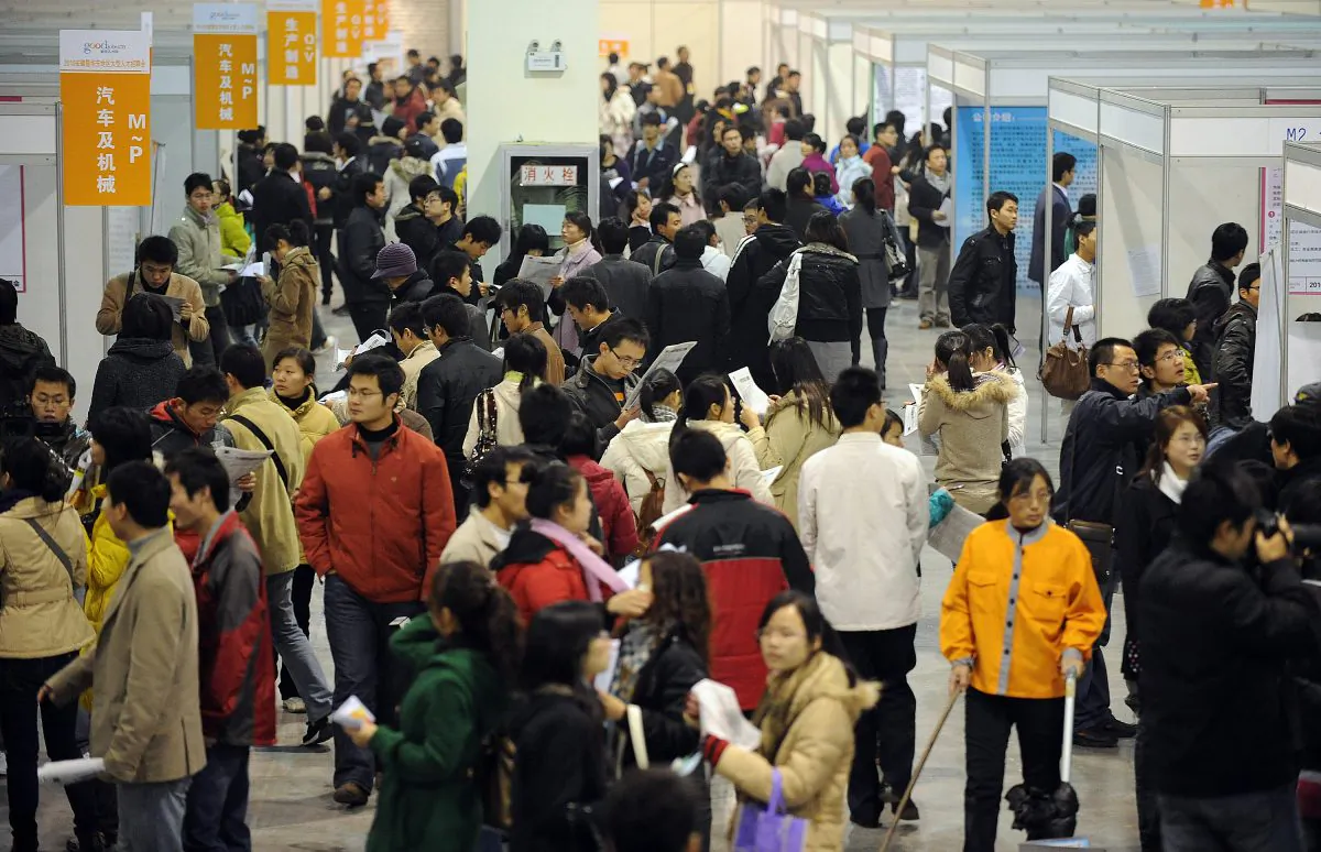 Chinese students seek jobs on offer at an employment fair in Hefei, in east China's Anhui province on Nov. 19, 2009. Students graduating from university in China sometimes only receive their degrees if they present a signed employment contract to their university; this has led to faked employment contracts, inflating the employment statistics. (AFP/AFP/Getty Images)