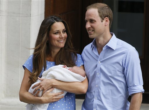 Britain's Prince William, right, and Kate, Duchess of Cambridge hold the Prince of Cambridge, Tuesday July 23, 2013, as they pose for photographers outside St. Mary's Hospital exclusive Lindo Wing in London where the Duchess gave birth on Monday July 22. The Royal couple are expected to head to London’s Kensington Palace from the hospital with their newly born son, the third in line to the British throne. (AP Photo/Kirsty Wigglesworth)