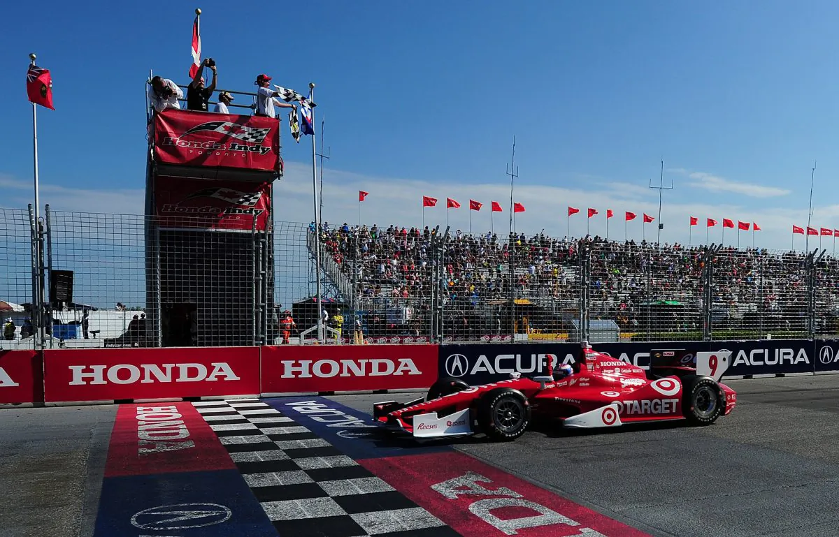 Scott Dixon, driver of the #9 Target-Chip Ganassi Racing Honda Dallara crosses the finish line to win race #2 of the Izod IndyCar Series Honda Indy Toronto on July 14, 2013 in the streets of Toronto, Ontario, Canada. (Robert Laberge/Getty Images)