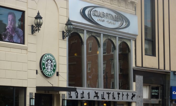 A new Club Fitness, Starbucks, as well as three banks in Astoria, Queens where small local businesses fill most storefronts. Landlords sometimes prefer chain store tenants with their corporate guarantors to a small independent retailer. (Nick Zifcak/Epoch Times) 