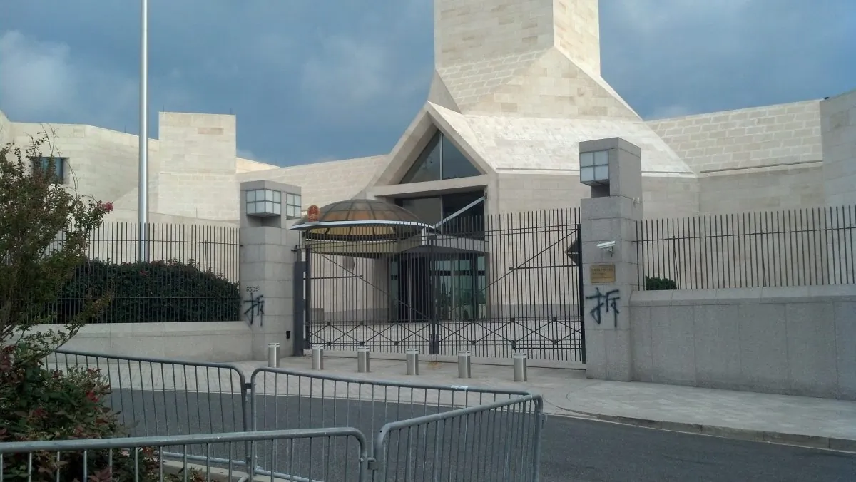 A photo of two instances of the Chinese character "demolish" graffitied to the front of the Chinese Embassy in Washington D.C.