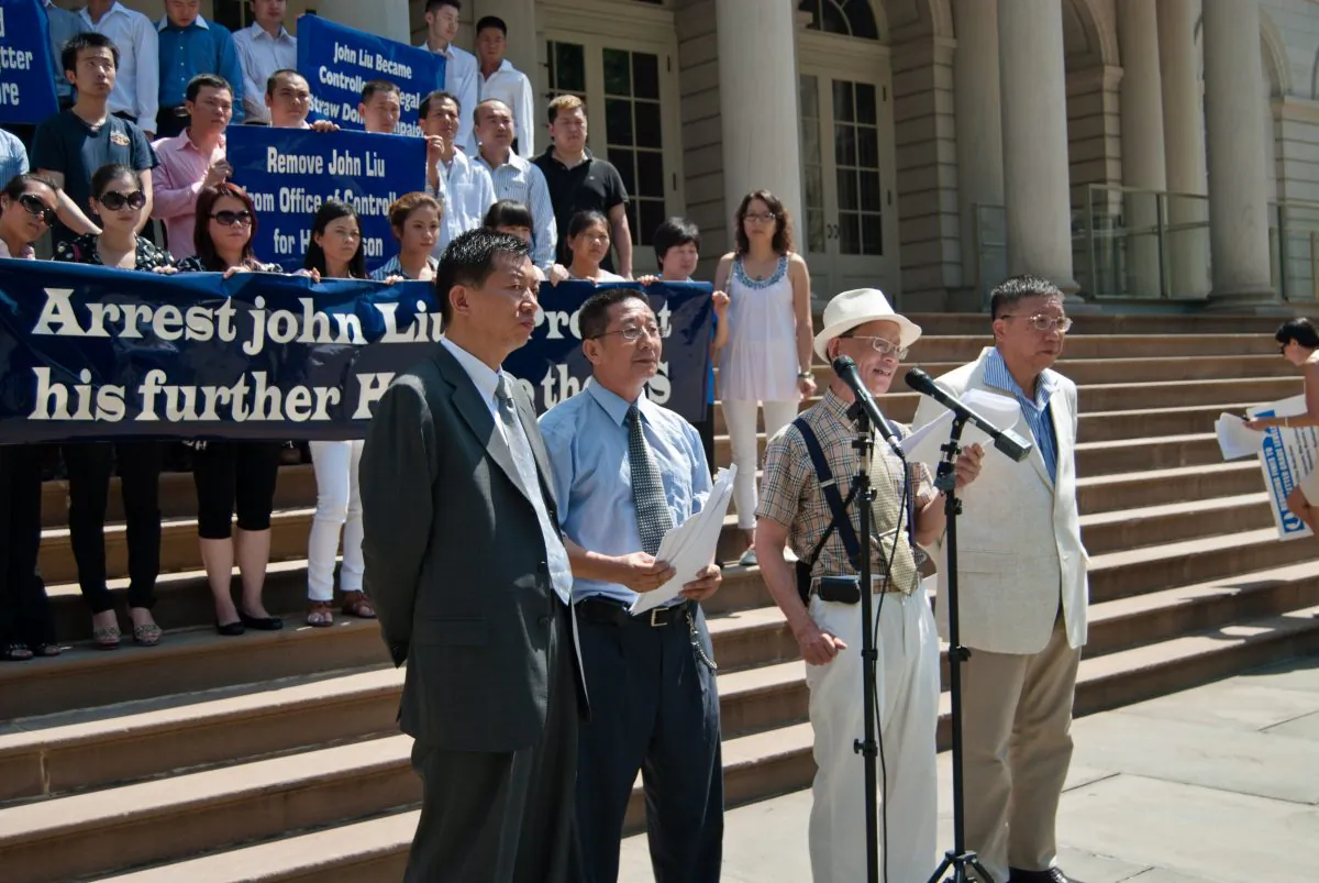 Chinese residents stand at the steps of City Hall in New York City on July 8 to call for the arrest of NYC Comptroller John Liu. (Joshua Philipp/Epoch Times Staff)