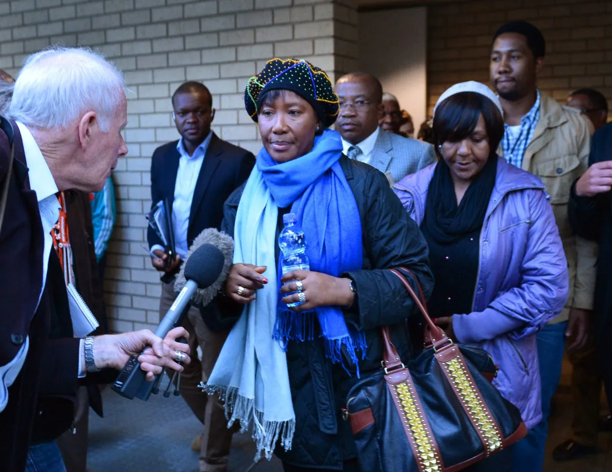 Makaziwe Mandela (C), daughter of Nelson Mandela, followed by Ndileka Mandela (C) and Ndaba (back R), the grandchildren of Mandela, leave the Mthatha high court on July 3, 2013. Nelson Mandela, who succeeded at battling rampant racism in the country, has had his final days become another struggle amidst warring family members. (Carl De Souza/AFP/Getty Images)