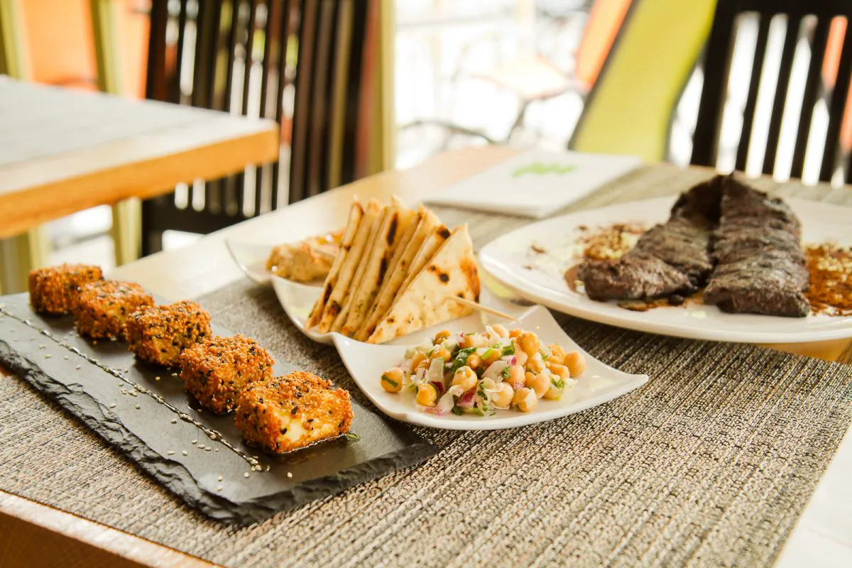 Ovelia’s Greek coffee steak, sesame crusted feta with a drizzle of Greek honey, and chickpea salad. (Jan Jekielek/Epoch Times)