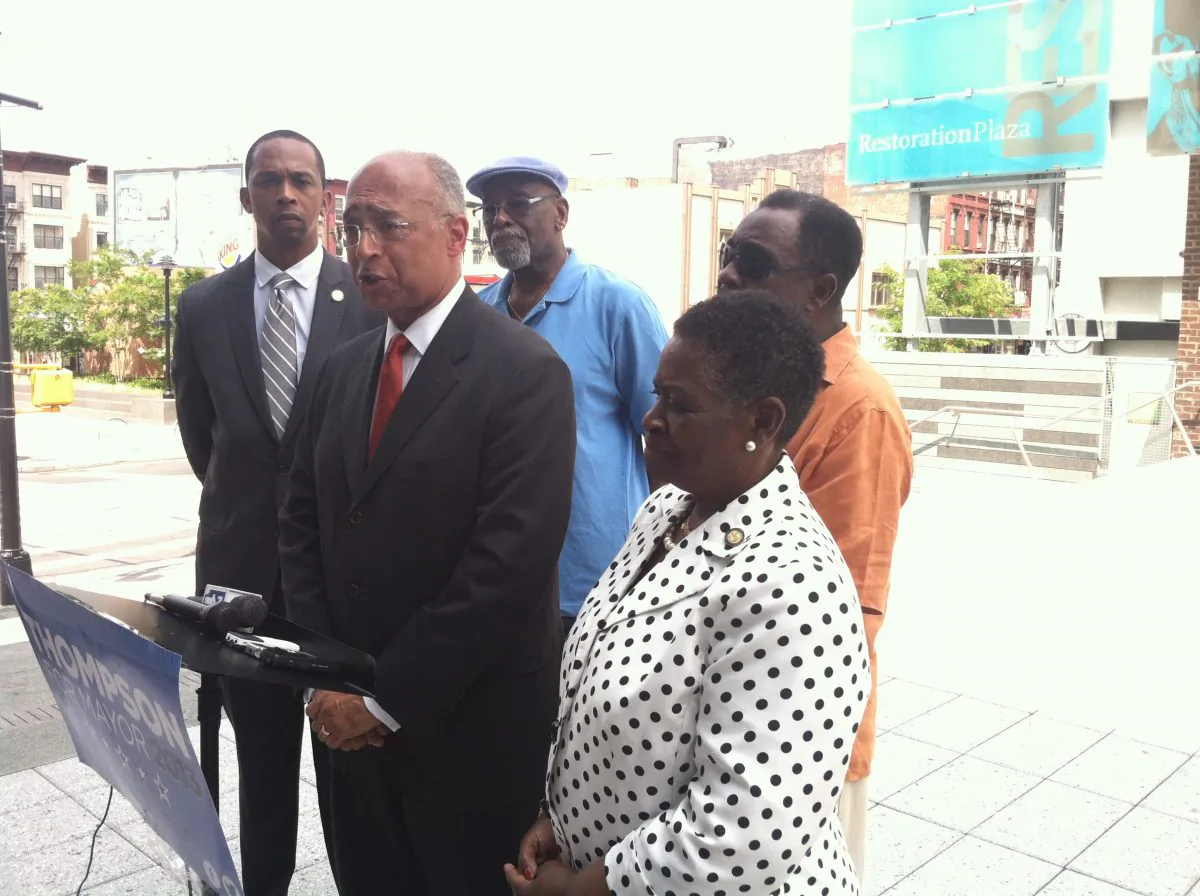 Candidate for mayor of New York City Bill Thompson is flanked by New York State Assembly and City Council members on Monday, July 15. Thompson was speaking from the neighborhood of Bedford-Stuyvesant against gun violence. 