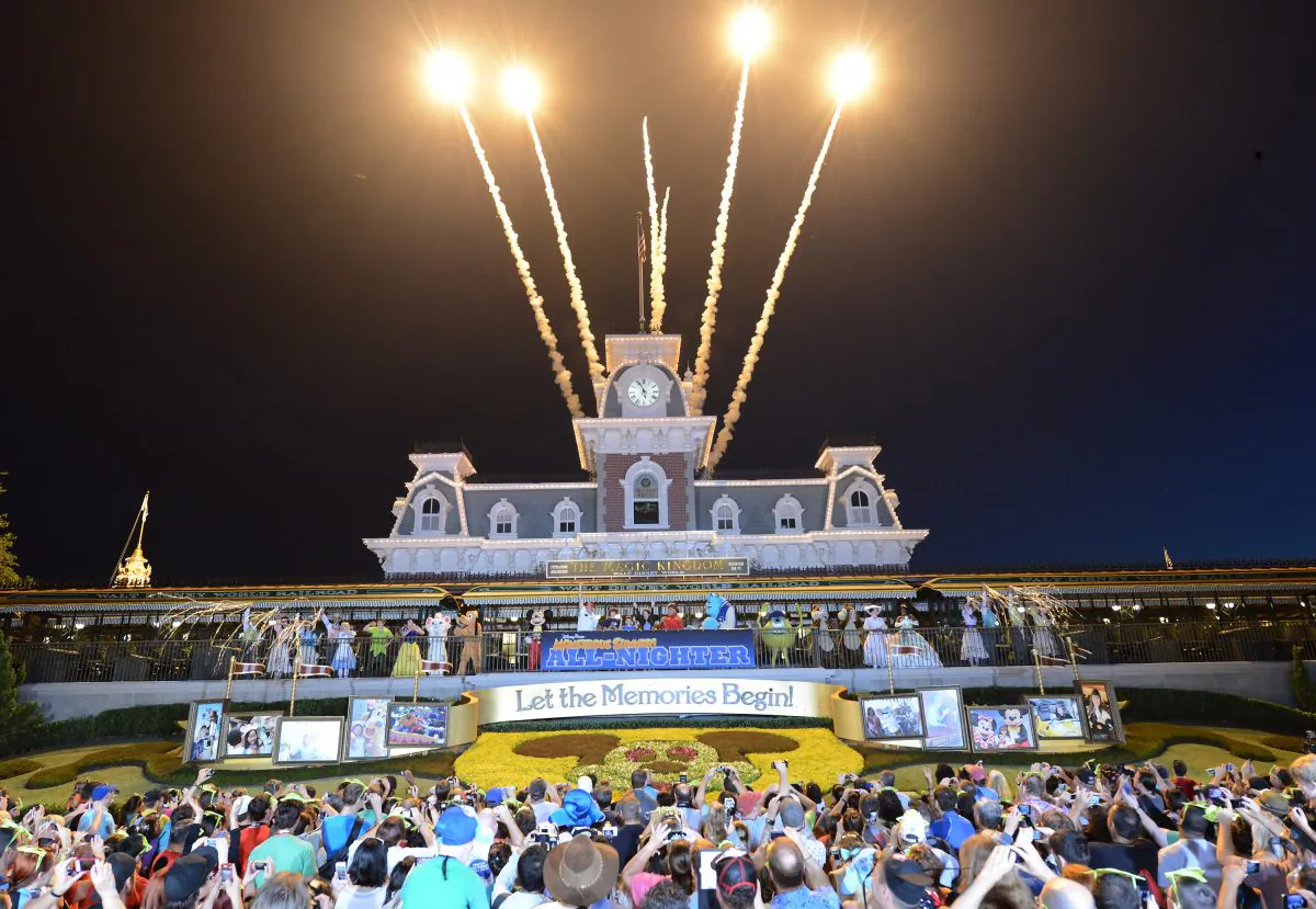 A handout image provided by Disney Parks shows thousands of guests standing outside the Magic Kingdom park as fireworks signal the 6 a.m. opening for the theme park on May 24, 2013, in Lake Buena Vista, Florida. (Todd Anderson/Disney Parks via Getty Images) 