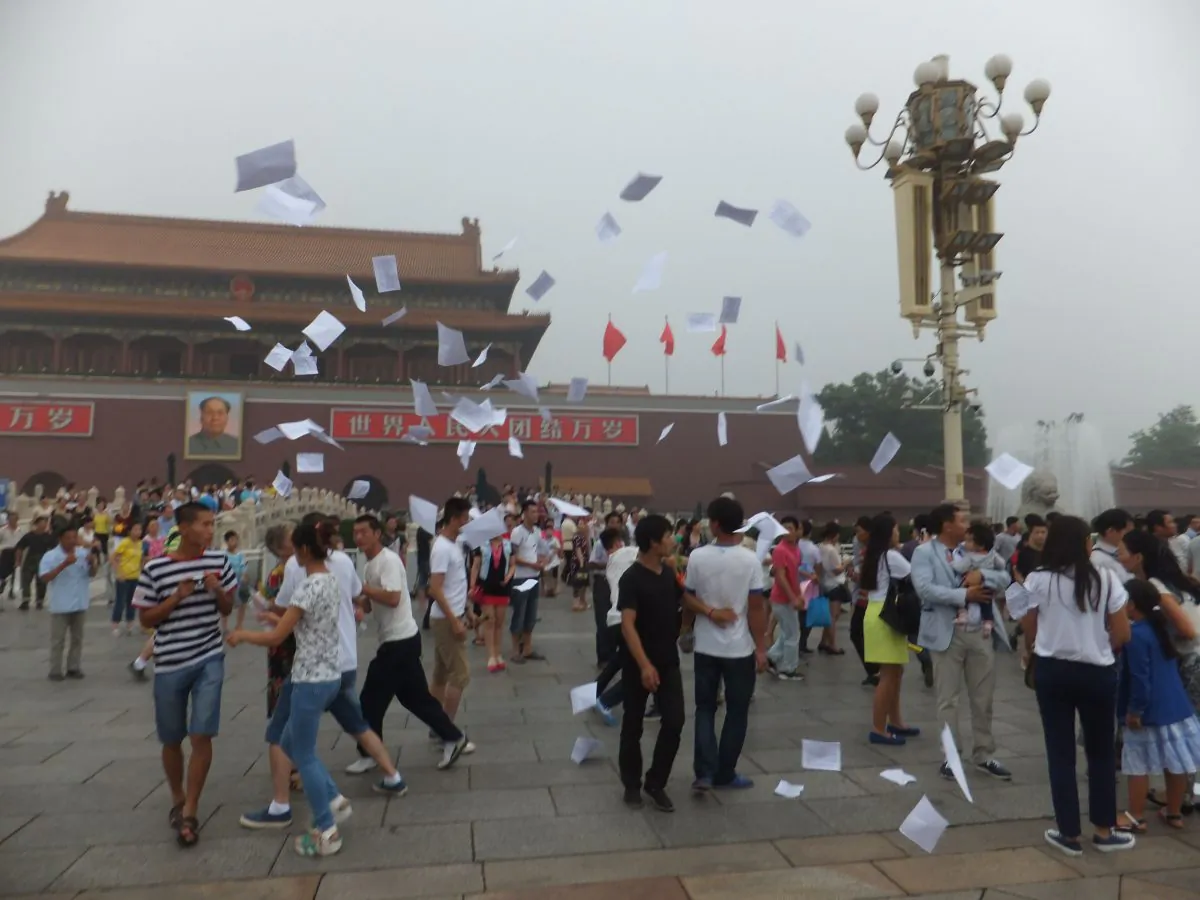 The Reddit user wrote as a caption: Snapping pics of The Gate of Heavenly Peace when suddenly about two dozen people simultaneously started shouting and throwing flyers in the air. I couldn't believe my eyes: was this what I thought it was? (Tiananmenthrowaway)