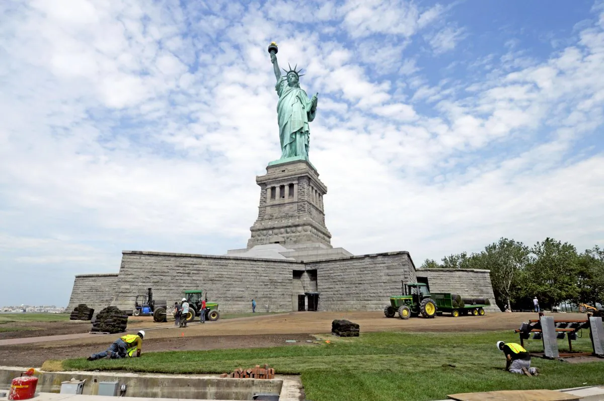 National Park Service workers on June 26, 2013 Liberty Island install sod around the Statue of Liberty national monument set to re-open on the 4th of July. (AP Photo/National Park Service,