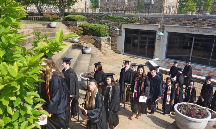 Students line up to graduate from Rhodes College in Memphis in May 2013. The federal interest rate for subsidized student loans doubled July 1. (Mary Silver/Epoch Times)