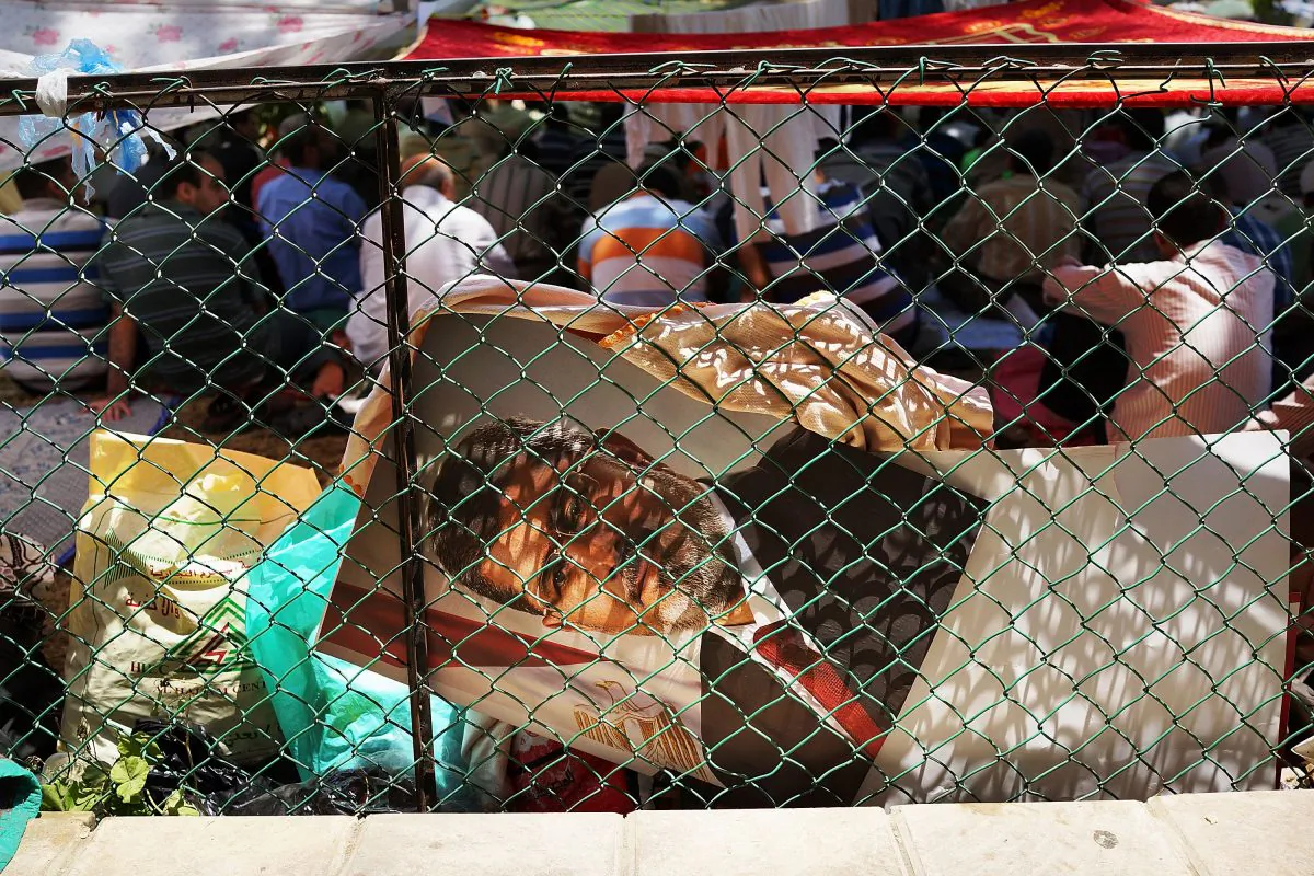 A picture of former Egyptian president Mohammed Morsi sits in a pile in Cairo, Egypt on July 5, 2013. Following the ousting of Morsi, Chinese state media ran editorials stating that the chaos in Egypt was proof of Western democracy's failure. (Spencer Platt/Getty Images)