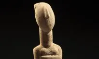 A Reclining Female Cycladic Marble Idol