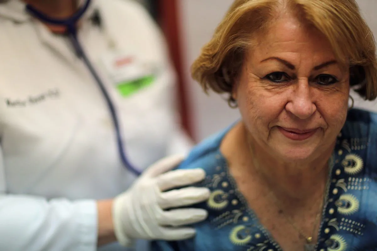 Dr. Martha Perez examines Maria Lebron in a room at the Community Health of South Florida, Doris Ison Health Center on February 21, 2013 in Miami, Florida.  (Joe Raedle/Getty Images)