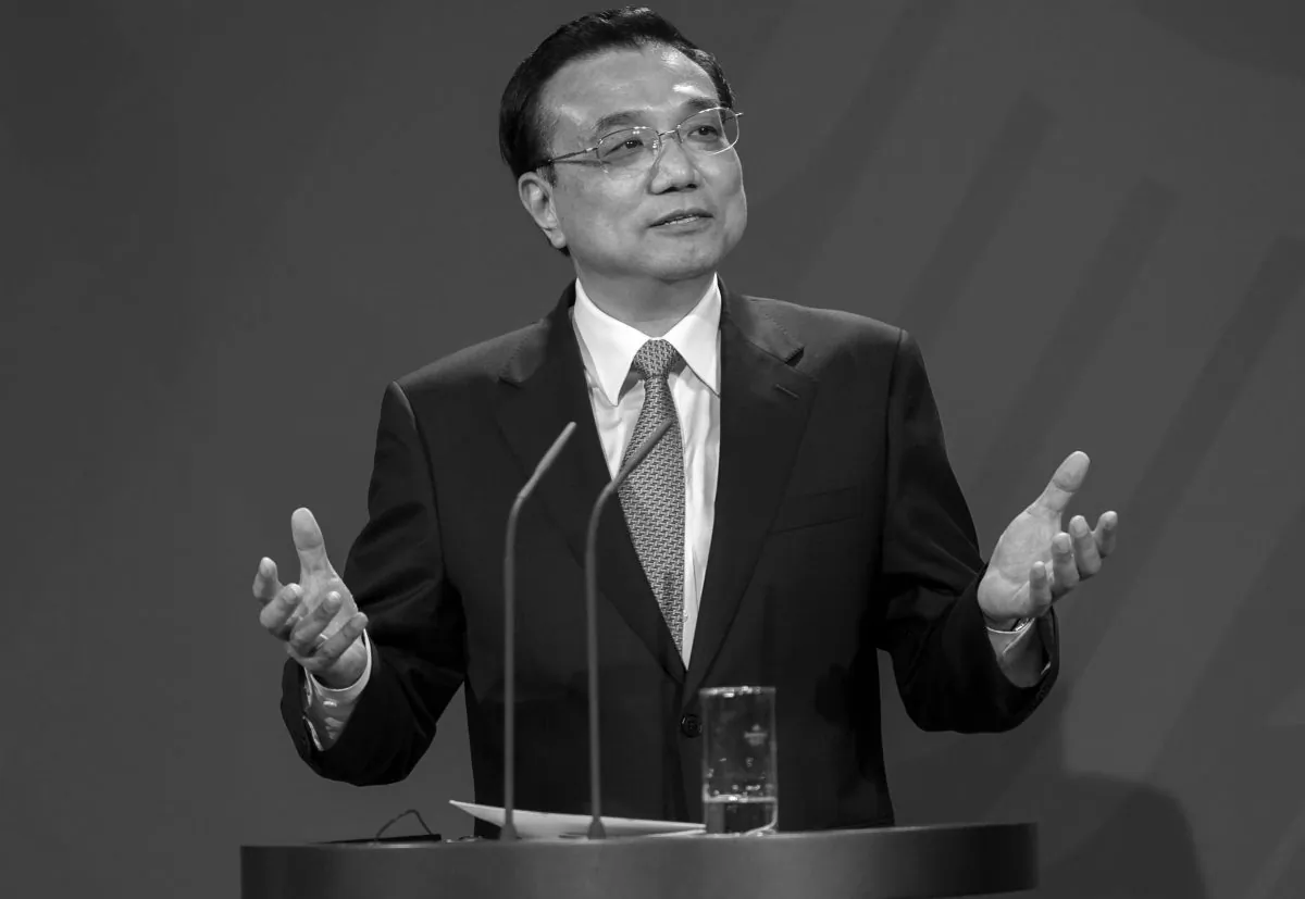 In this file photo, Chinese Prime Minister Li Keqiang gestures at a press conference on May 26, 2013, in Berlin, Germany. Li Keqiang’s name has been attached to a package of economic reforms for China, which appear now to be falling apart. (Carsten Koall/Getty Images)
