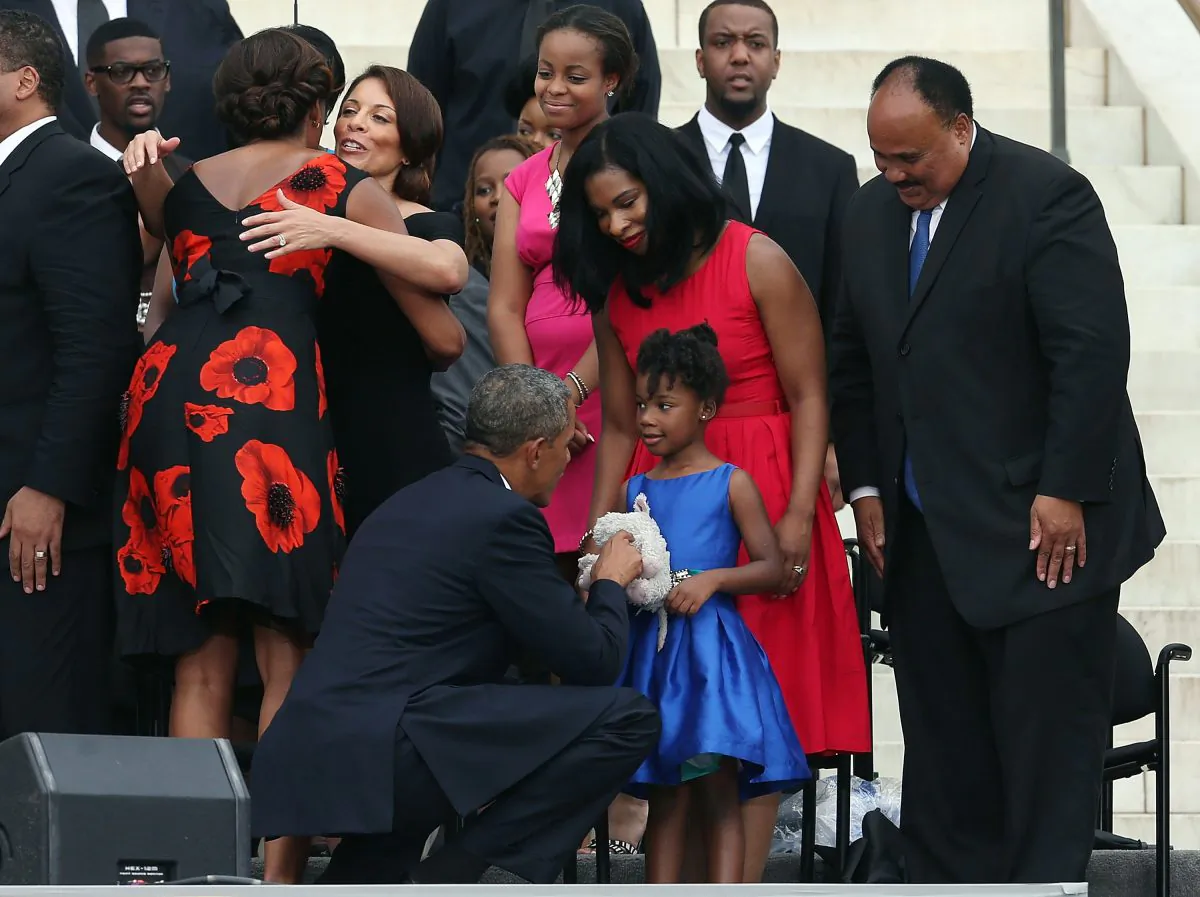 President Barack Obama greets Yolanda King, daughter of Martin Luther King III (R), and his wife, Arndrea King (2nd-R), as they commemorate the 50th anniversary of the March on Washington in Washington, D.C., Aug. 28. (Mark Wilson/Getty Images)