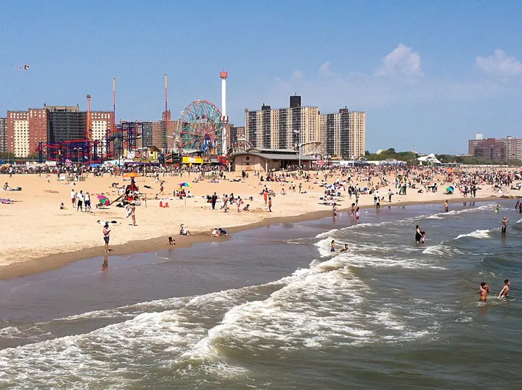 Beach goers enjoy a day in the sun at New York's Coney Island. (Kristen Meriwether/Epoch Times)
