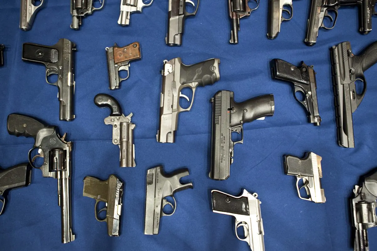 Hundreds of guns were hidden in car panels and doors as part of an international weapon-smuggling operation. These handguns are in a 2013 file photo. (Samira Bouaou/The Epoch Times)