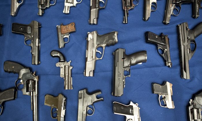 Hundreds of guns were hidden in car panels and doors as part of an international weapon-smuggling operation. These handguns are in a 2013 file photo. (Samira Bouaou/The Epoch Times)