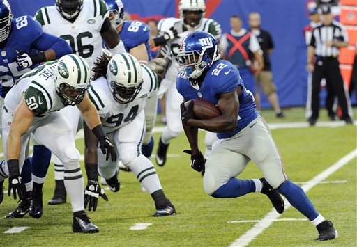 New York Giants running back David Wilson (22) rushes for a touchdown during the first half of a preseason NFL football game against the New York Jets, Saturday, Aug. 24, 2013, in East Rutherford, N.J. (AP Photo/Bill Kostroun)