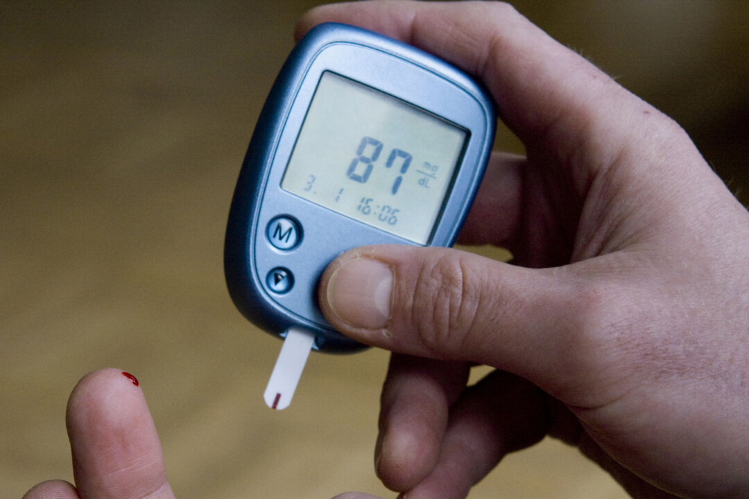 This Jan. 3, 2009, photo shows a person with diabetes testing his blood sugar level in Kamen, Germany. (AP Photo/Joerg Sarbach)