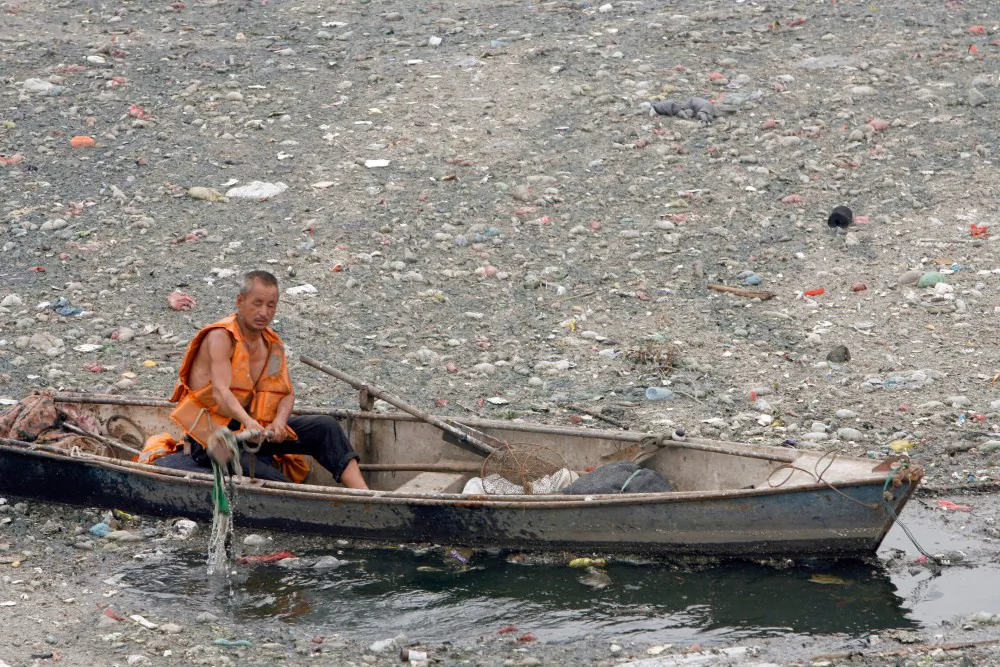 File photo: According to a recent report by the Environmental Protection Supervision Center of North China, samples taken from 37 rivers in the Beijing areas had levels of pollution higher than what is considered safe. (Teh Eng Koon/AFP/Getty Images) 