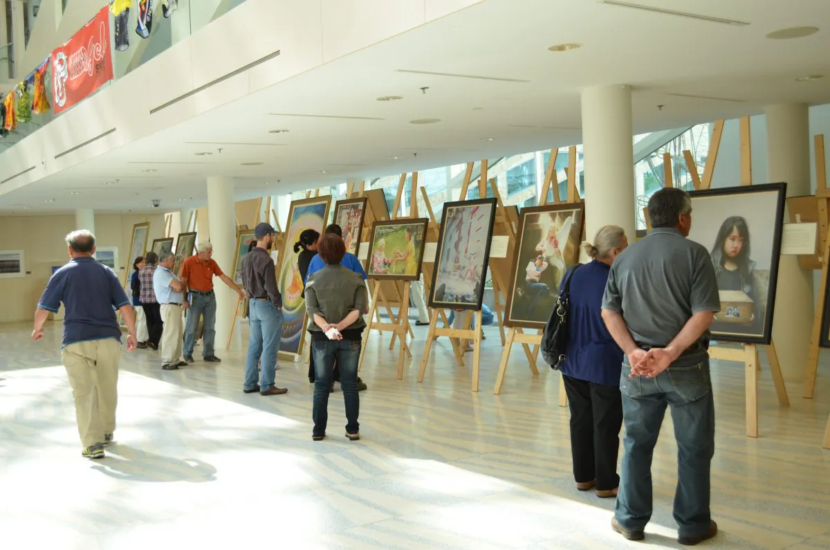 Visitors attend the Art of Zhen, Shan, Ren International Exhibition on its opening day at Edmonton City Hall on Aug. 25, 2013. (Epoch Times)