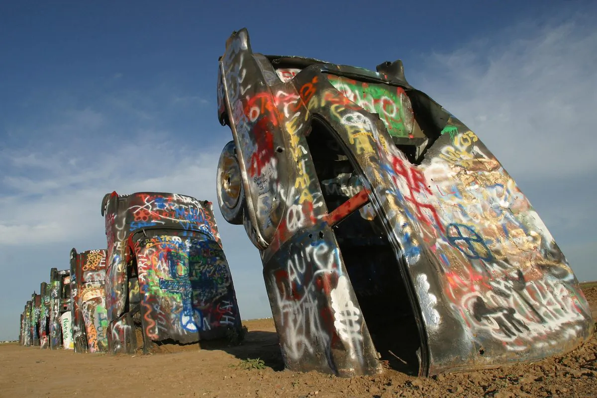 Cars at “Cadillac Ranch”' on historic Route 66 in Amarillo, 06 July 2003. As a tribute to America's relationship with one of its favorite automobiles, a collective of artists called Ant Farm in 1974 placed 10 Cadillacs, ranging from a 1949 Club Coupe to a 1963 Sedan, in a wheat field located west of Amarillo. (Robyn Beck/AFP/Getty Images)