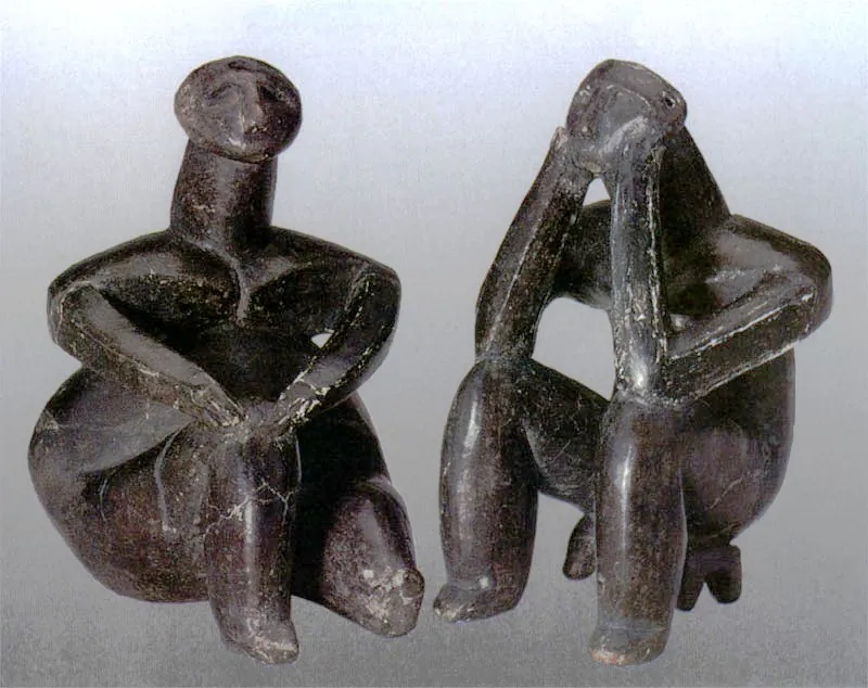 The Thinker of Hamangia (R) and his lady friend, thought to be created by the same hand. (WikiMedia Commons)