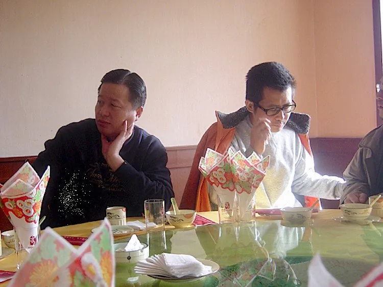 Gao Zhisheng (L) and Guo Feixiong (R) at a restaurant in 2006.