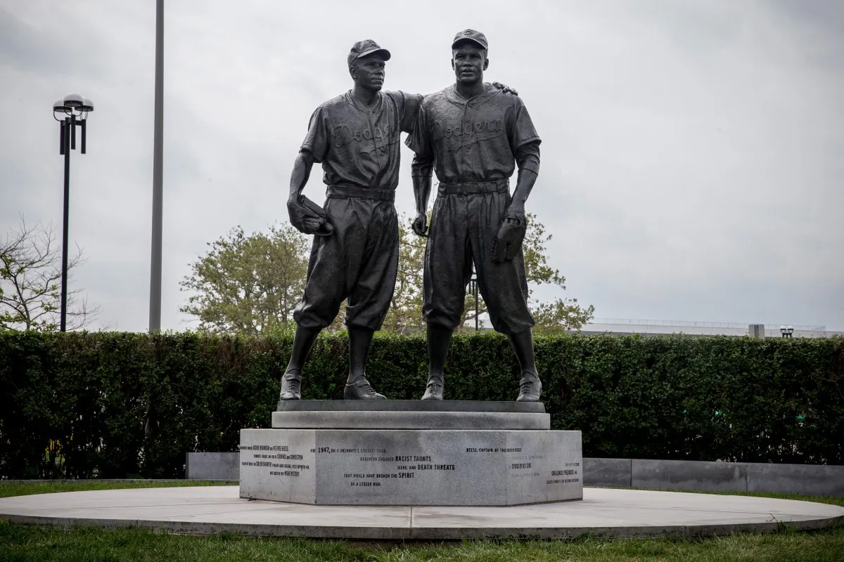 A statue of Pee Wee Reese (L) and Jackie Robinson after being cleaned of racist graffiti. The statue, which was unveiled in 2005, was recently defaced with racist graffiti and the city recently finished restoring the statue using sandblasting and power washing to remove it. (Andrew Burton/Getty Images) 