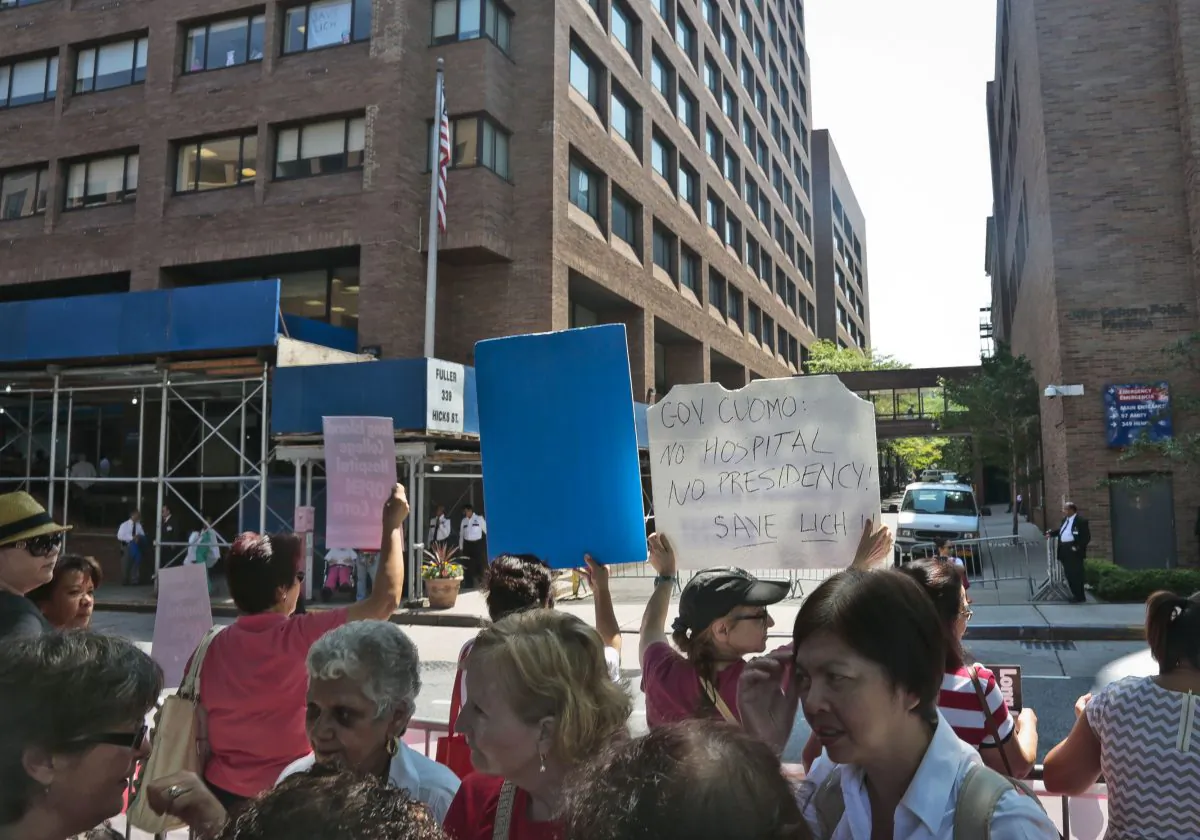 Members of the New York State Nurses Association and their supporters rally outside Long Island College Hospital  on Monday, July 29 in Brooklyn. The City of New York is asking for a $10 million waiver to prevent hospital closures. (AP Photo/Bebeto Matthews)