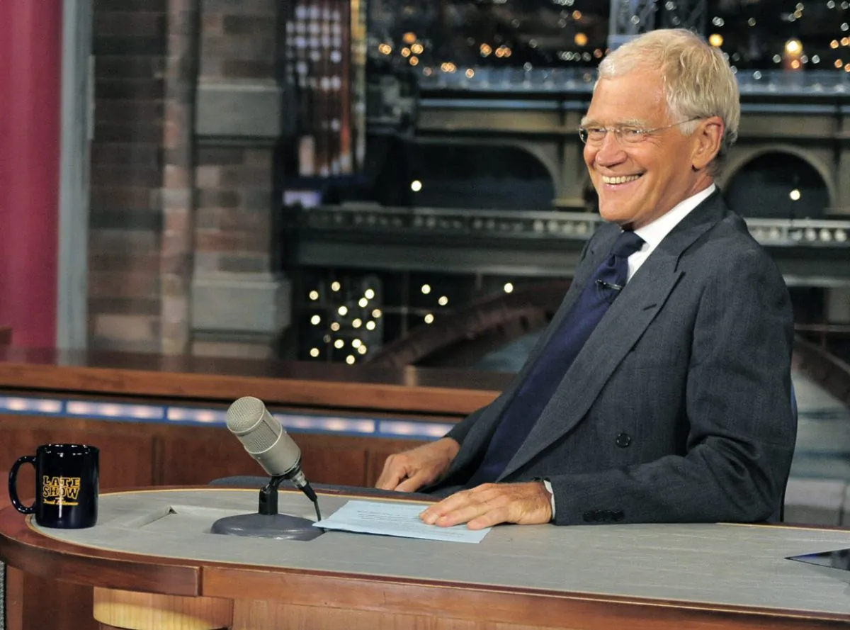 Host David Letterman smiles on the set of the “Late Show with David Letterman,"on July 16, 2013. (AP Photo/CBS, John Paul Filo)