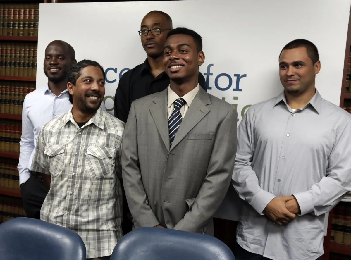 Nicholas Peart, Lilat Clarkson, Leroy Downes, Devin Almonar and David Ourlicht, (L-R), plaintiffs in the stop and frisk case, pose for a photo after a news conference at the Center for Constitutional Rights, in New York, Monday, Aug. 12, 2013. U.S. District Judge Shira Scheindlin ruled that the New York Police Department deliberately violated the civil rights of tens of thousands of New Yorkers with its contentious stop-and-frisk policy, and an independent monitor is needed to oversee major changes. (Richard Drew/AP Photo) 